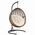 Fauteuil suspendu en rotin coussin beige structure en acier 120 kg