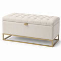 Banc de rangement en tissu beige avec structure en métal doré