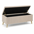 Banc de rangement en velours beige avec pieds en métal doré