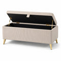 Banc de rangement beige en tissu côtelé avec pieds en métal doré